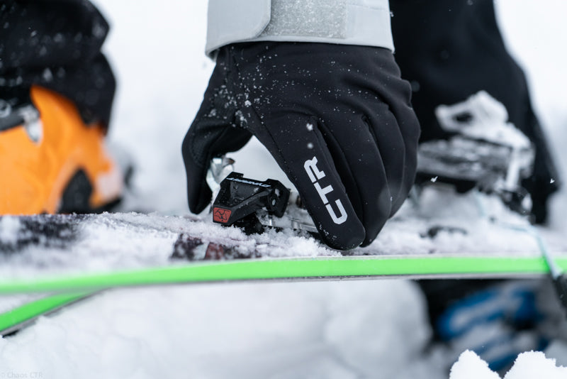 skier-adjusting-binder-on-ski-while-wearing-ctr-gloves-showing-dexterity-of-glove